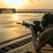 USS Tripoli Conducts A Sunrise Gun Shoot