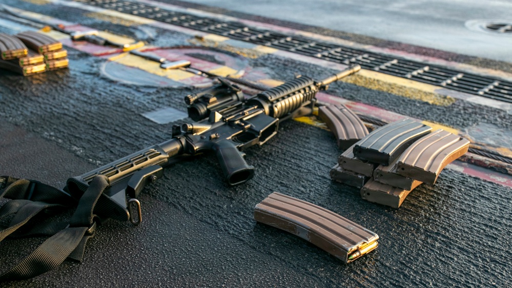 USS Tripoli Conducts A Sunrise Gun Shoot