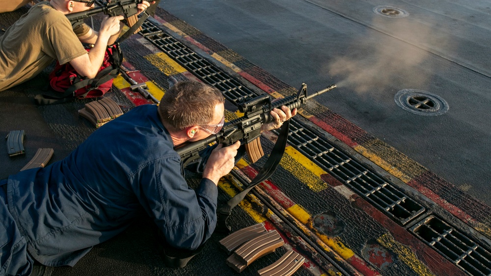 USS Tripoli Conducts A Sunrise Gun Shoot