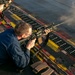USS Tripoli Conducts A Sunrise Gun Shoot
