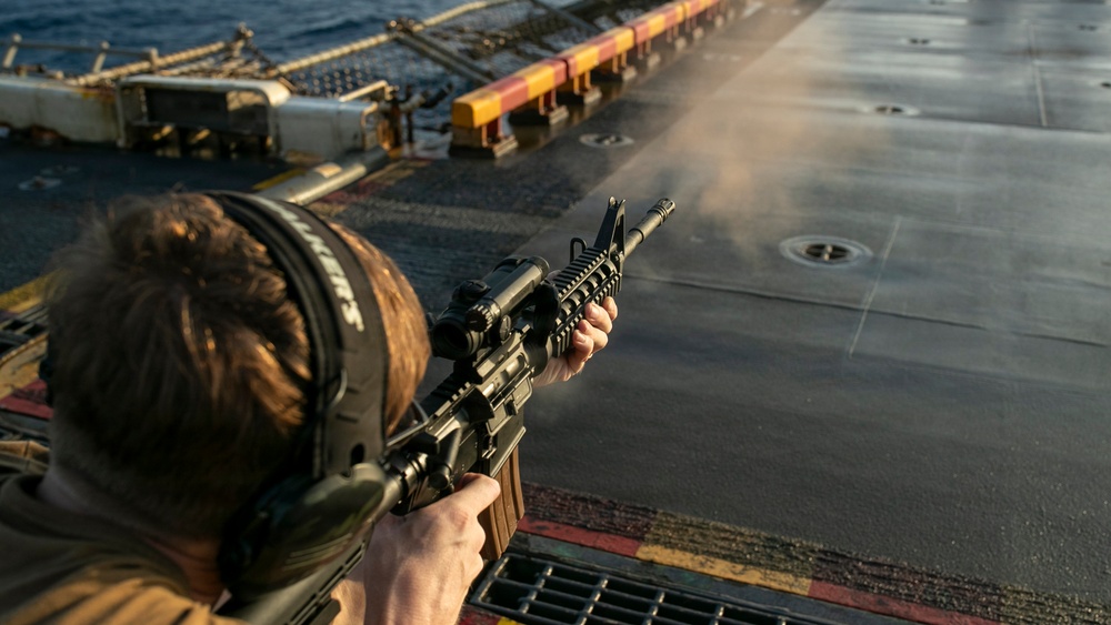 USS Tripoli Conducts A Sunrise Gun Shoot