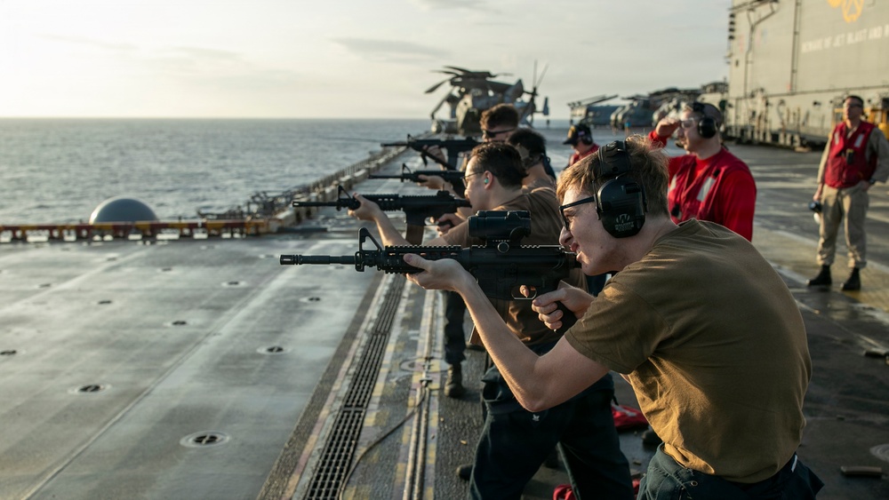 USS Tripoli Conducts A Sunrise Gun Shoot