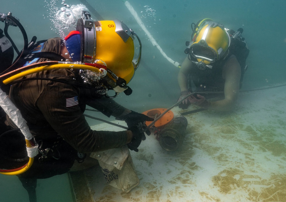 Multinational Navy divers work together during a salvage training at RIMPAC 26