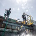Multinational Navy divers work together during a salvage training at RIMPAC 26