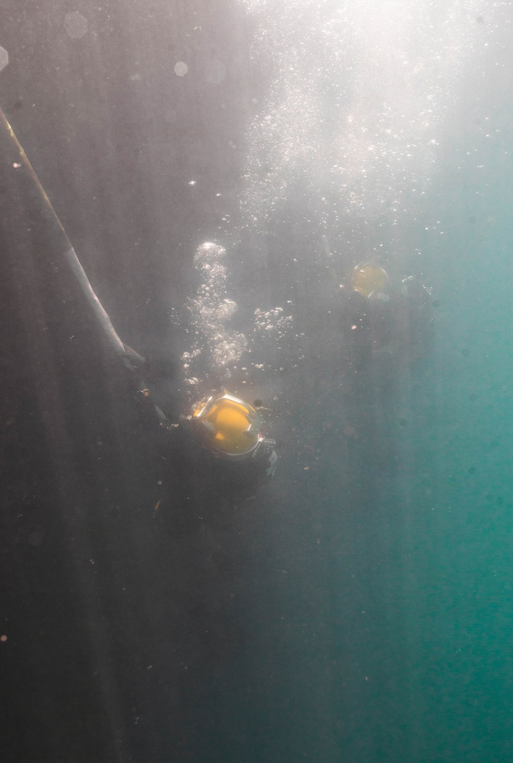 Multinational Navy divers work together during a salvage training at RIMPAC 26