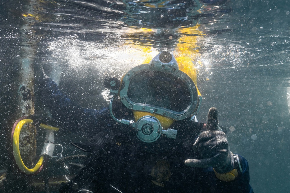 Multinational Navy divers work together during a salvage training at RIMPAC 26