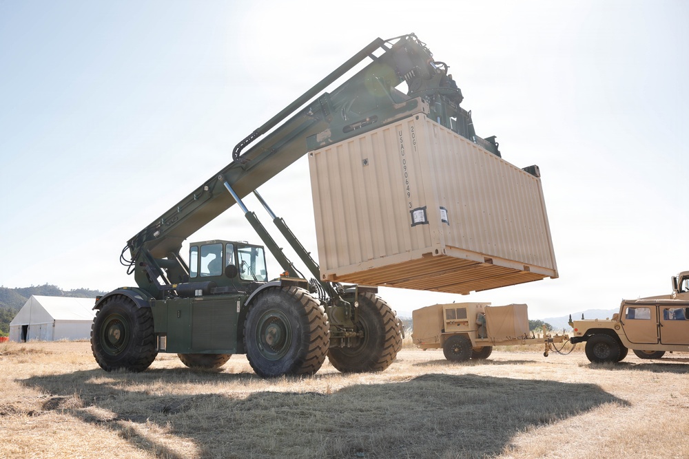 U.S. Army soldier operate a rough terrain container handler during logistics training exercise