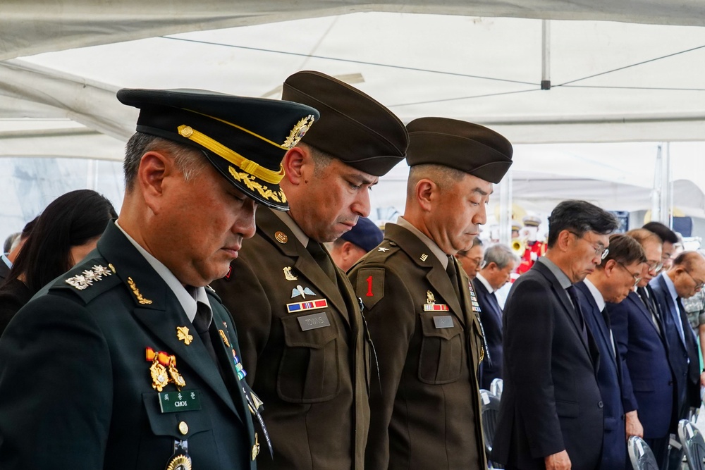 The command team pauses in remembrance