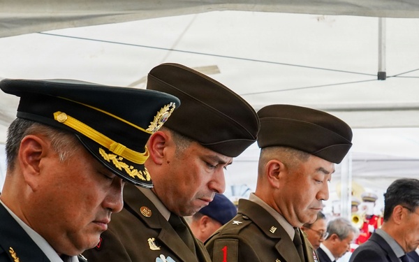 The command team pauses in remembrance