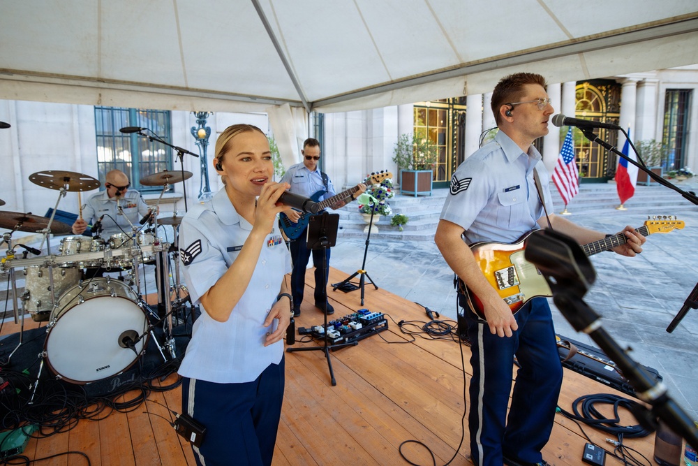 U.S. Air Forces in Europe Band vocalist SrA Natalie Angst performing at Ambassador Nicholas Merrick's residence in Prague, Czech Republic