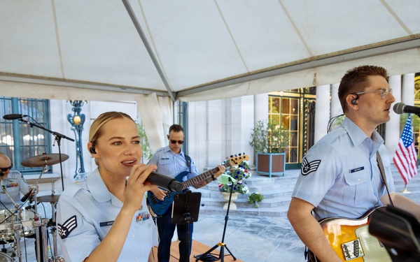 U.S. Air Forces in Europe Band vocalist SrA Natalie Angst performing at Ambassador Nicholas Merrick's residence in Prague, Czech Republic