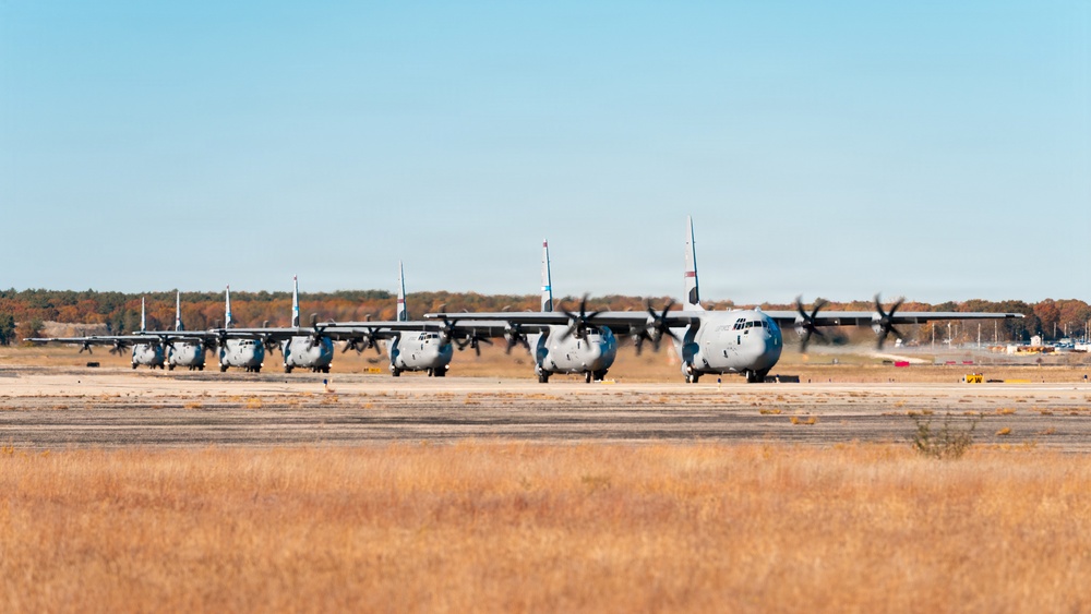 143d Airlift Wing conducts a 7-ship C-130J Hercules flyover