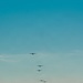 143d Airlift Wing conducts a 7-ship C-130J Hercules flyover