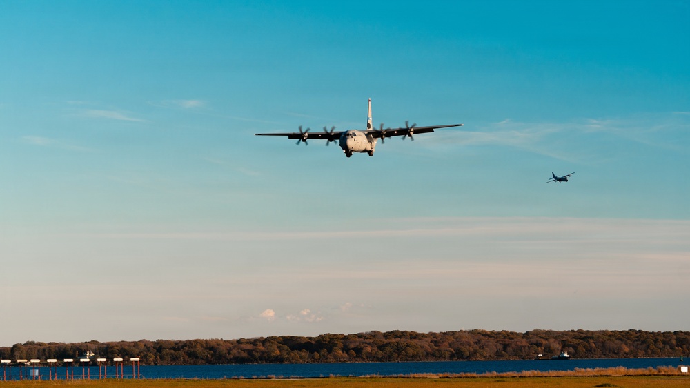 143d Airlift Wing conducts a 7-ship C-130J Hercules flyover