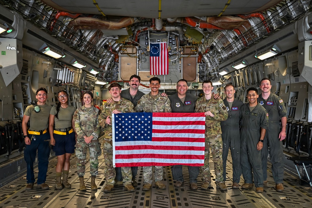 15th Airlift Squadron conducts Salute from the Shore flyover