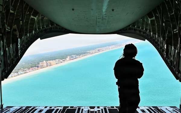 15th Airlift Squadron conducts Salute from the Shore flyover