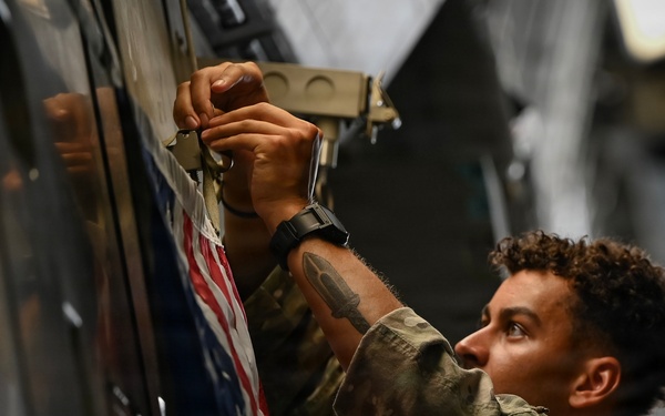 15th Airlift Squadron conducts Salute from the Shore flyover
