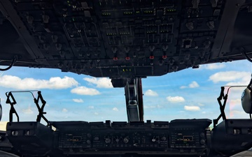 15th Airlift Squadron conducts Salute from the Shore flyover