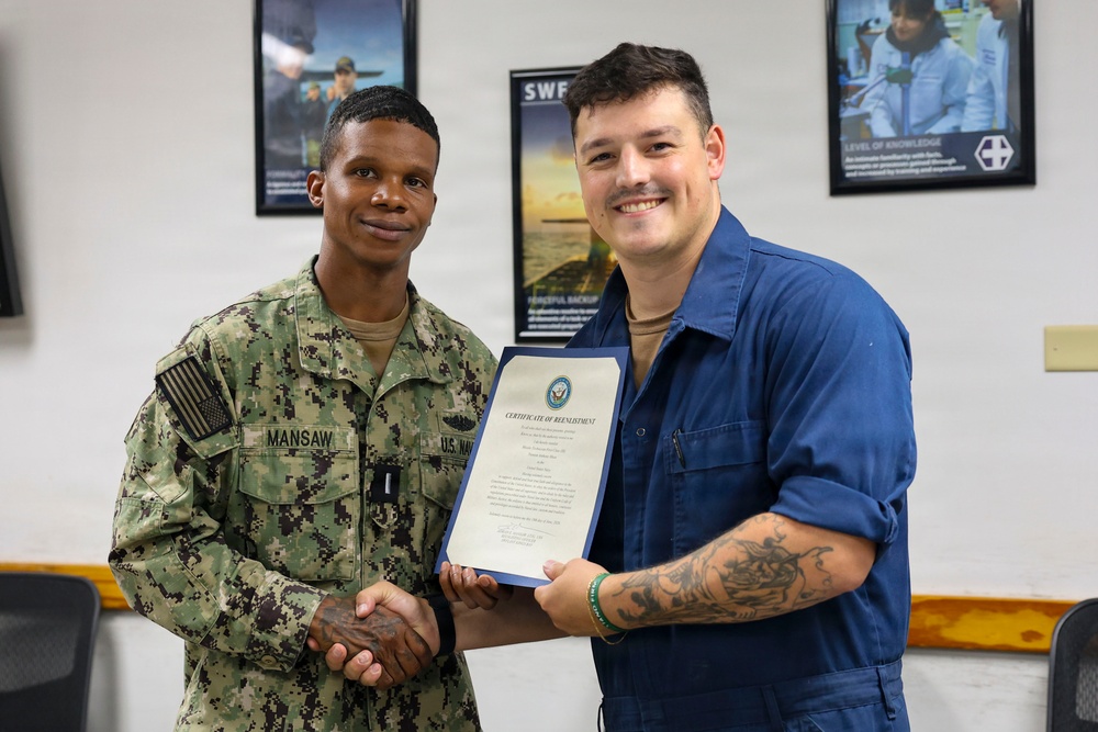 Missile Technician 1st Class Trenton Musa Re-enlists