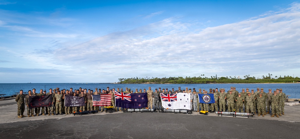 Multinational personnel with CTF 177 gather at Pearl Harbor during RIMPAC 2026