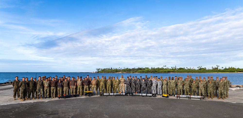 Multinational personnel with CTF 177 gather at Pearl Harbor during RIMPAC 2026