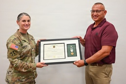 Tulsa District Commander presents public service medal to OHP retiree