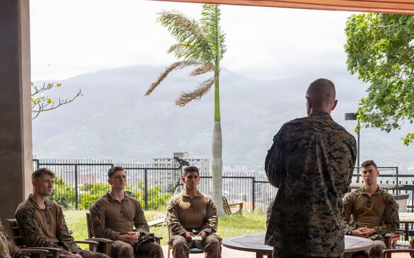Maj. Gen. Jarrard Speaks With Marine at U.S. Embassy Caracas