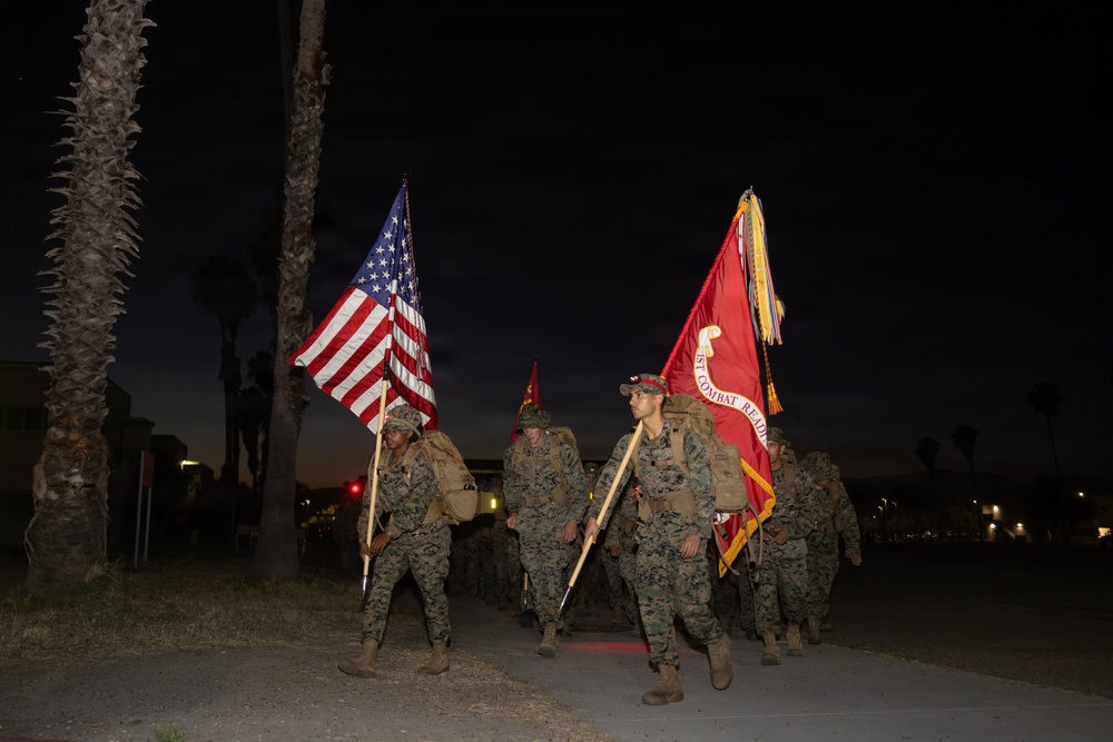 1st Combat Readiness Regiment Marines and Sailors participate in a 10k night hike