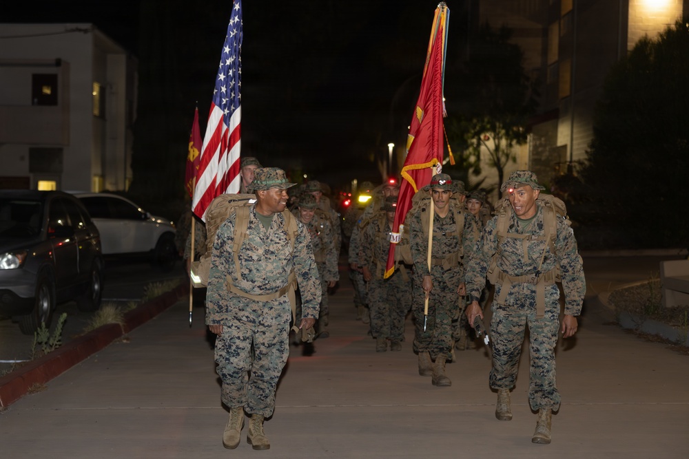 1st Combat Readiness Regiment Marines and Sailors participate in a 10k night hike