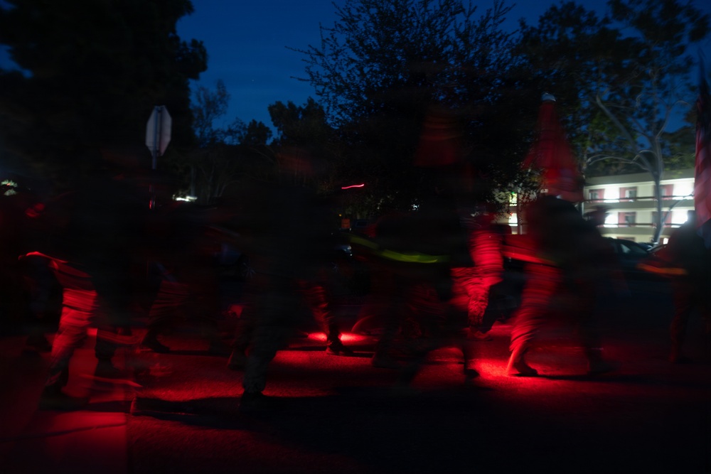 1st Combat Readiness Regiment Marines and Sailors participate in a 10k night hike