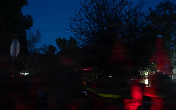 1st Combat Readiness Regiment Marines and Sailors participate in a 10k night hike