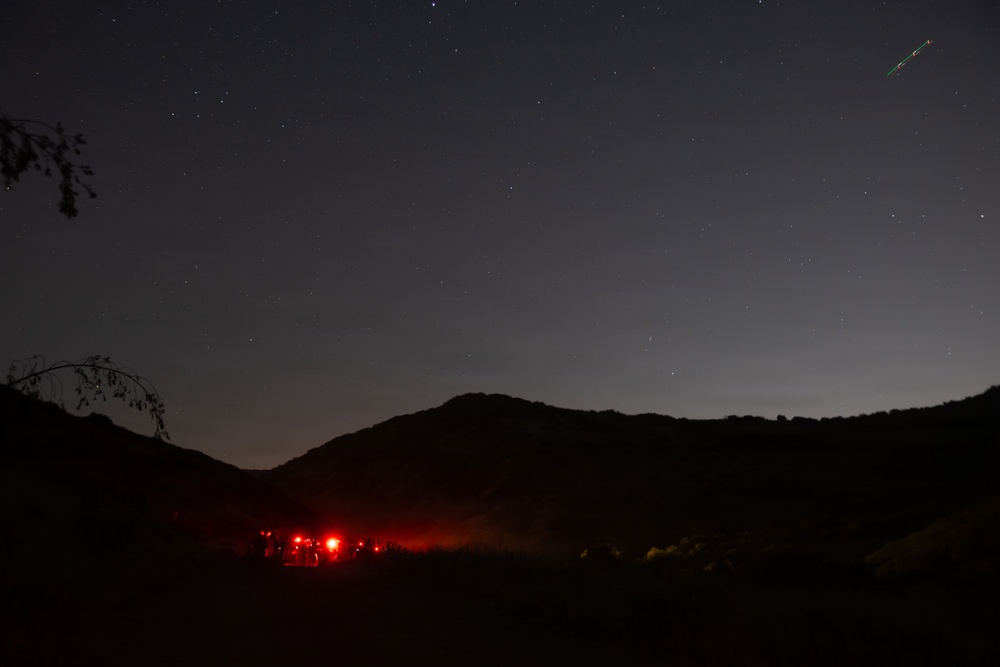 1st Combat Readiness Regiment Marines and Sailors participate in a 10k night hike