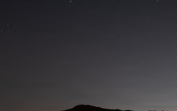 1st Combat Readiness Regiment Marines and Sailors participate in a 10k night hike