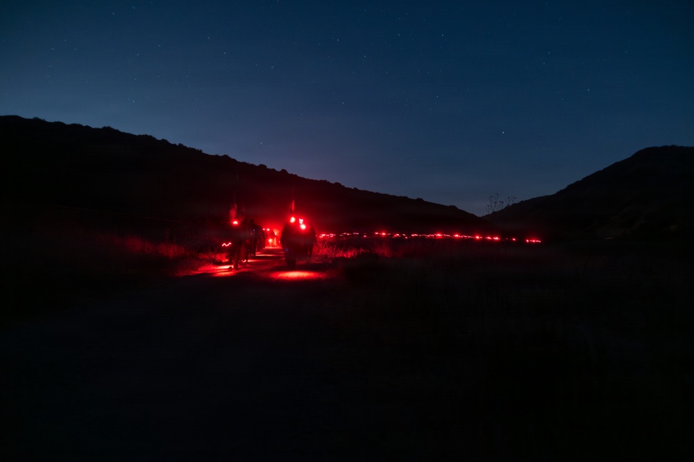 1st Combat Readiness Regiment Marines and Sailors participate in a 10k night hike