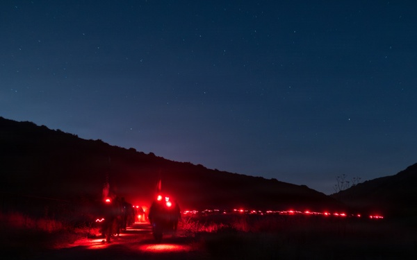 1st Combat Readiness Regiment Marines and Sailors participate in a 10k night hike