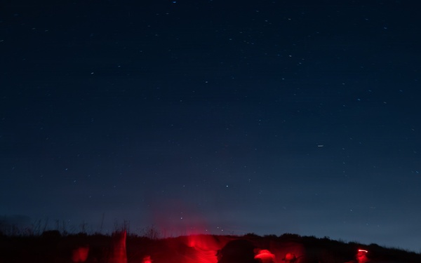 1st Combat Readiness Regiment Marines and Sailors participate in a 10k night hike