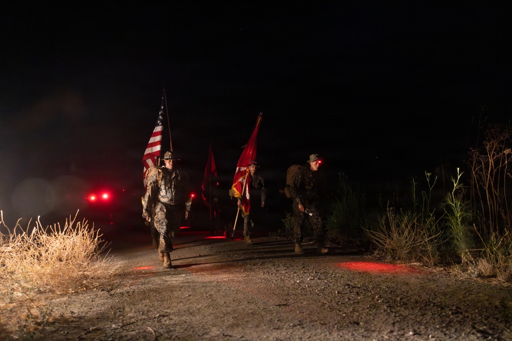 1st Combat Readiness Regiment Marines and Sailors participate in a 10k night hike