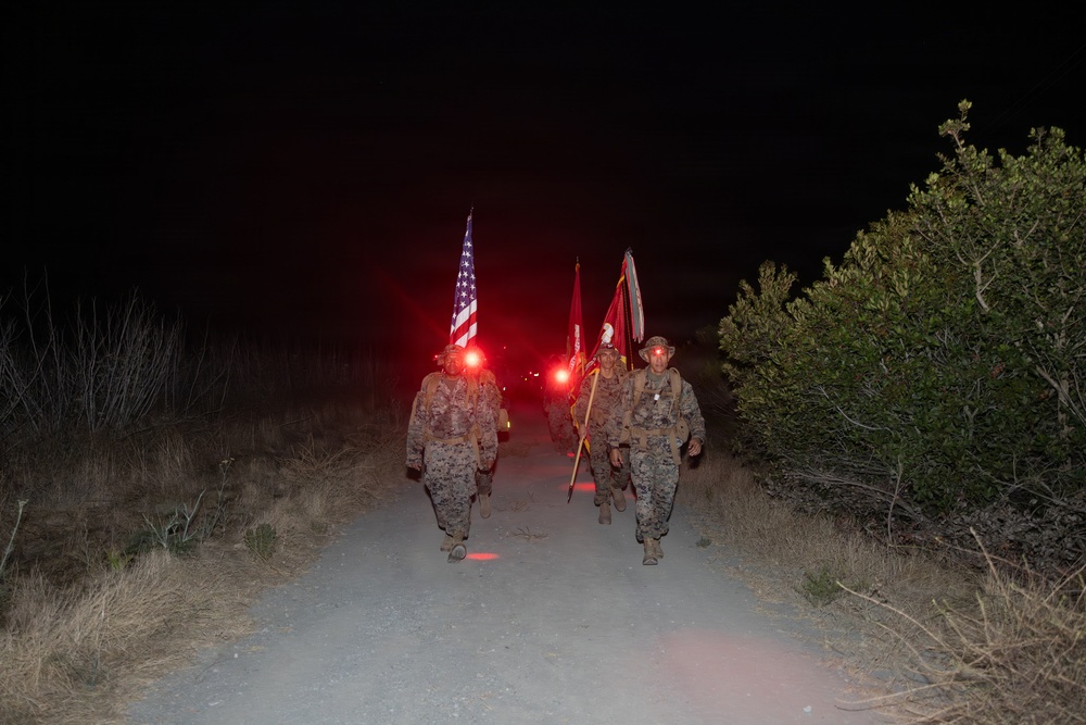 1st Combat Readiness Regiment Marines and Sailors participate in a 10k night hike