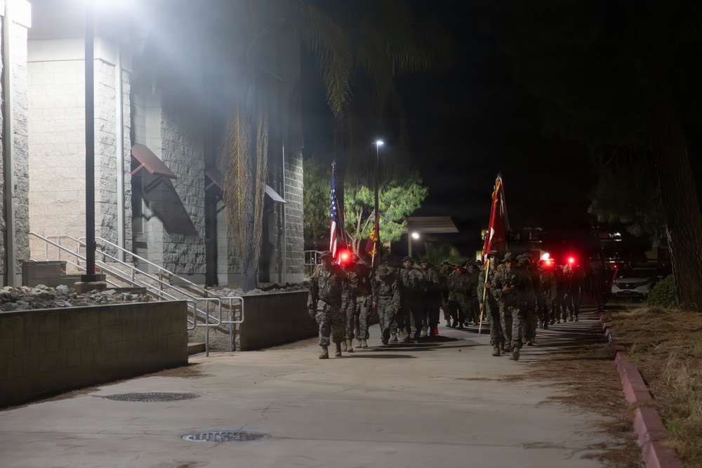 1st Combat Readiness Regiment Marines and Sailors participate in a 10k night hike