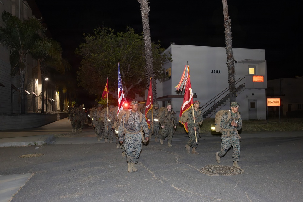 1st Combat Readiness Regiment Marines and Sailors participate in a 10k night hike