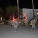 1st Combat Readiness Regiment Marines and Sailors participate in a 10k night hike
