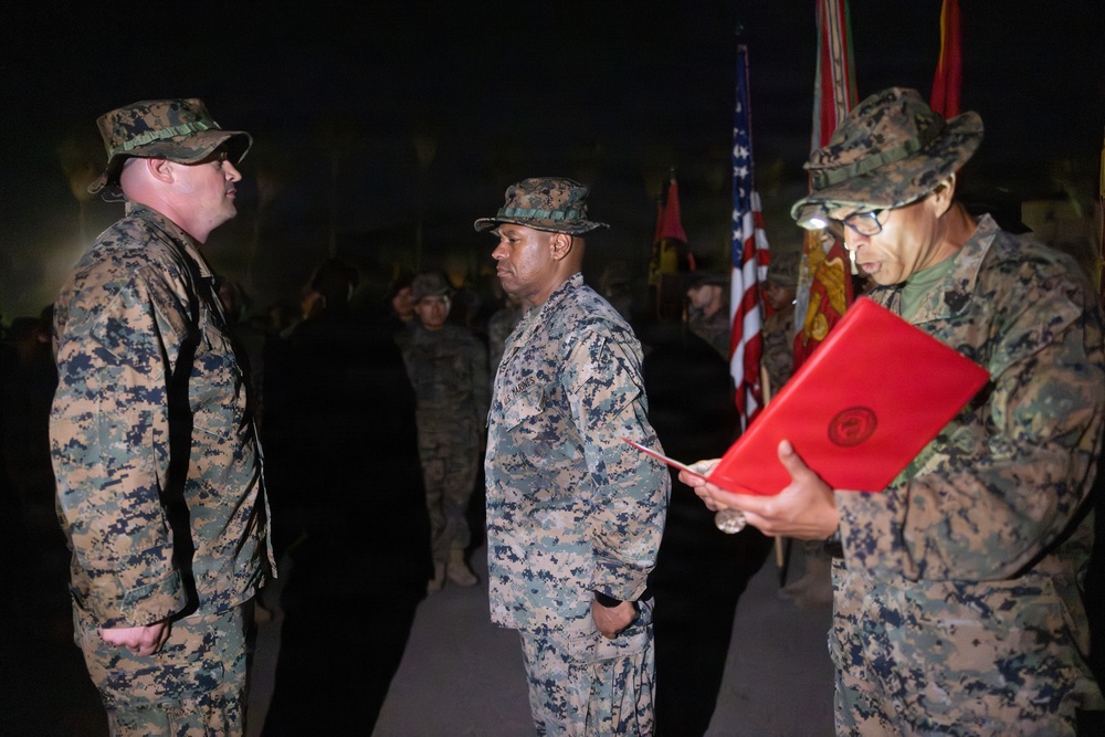 1st Combat Readiness Regiment Marines and Sailors participate in a 10k night hike