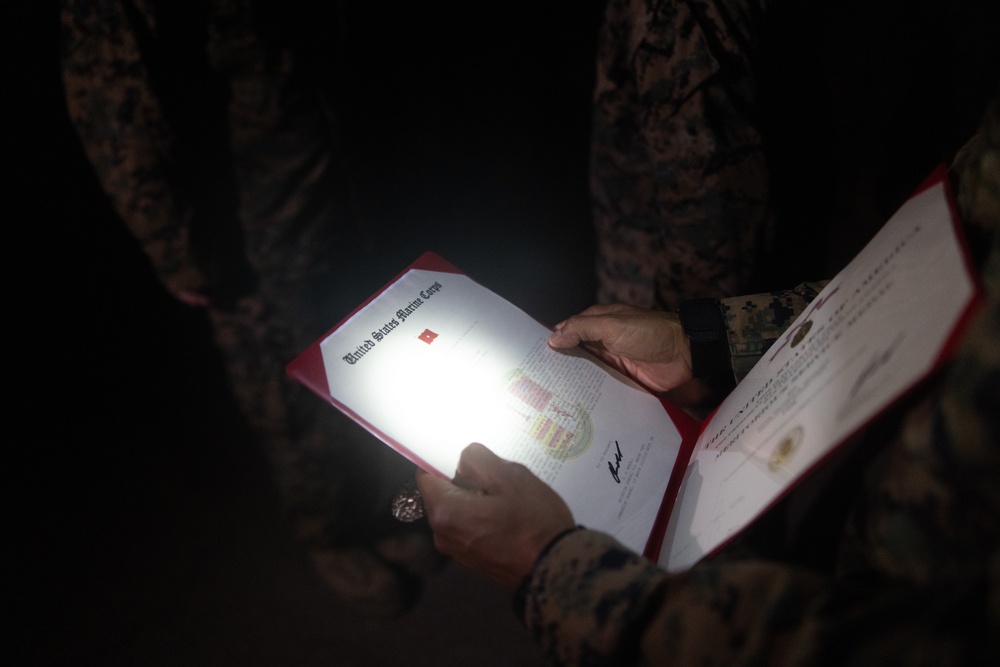 1st Combat Readiness Regiment Marines and Sailors participate in a 10k night hike