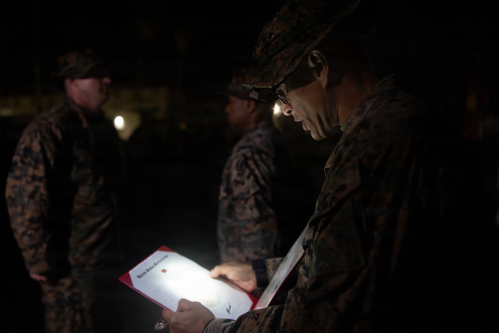 1st Combat Readiness Regiment Marines and Sailors participate in a 10k night hike