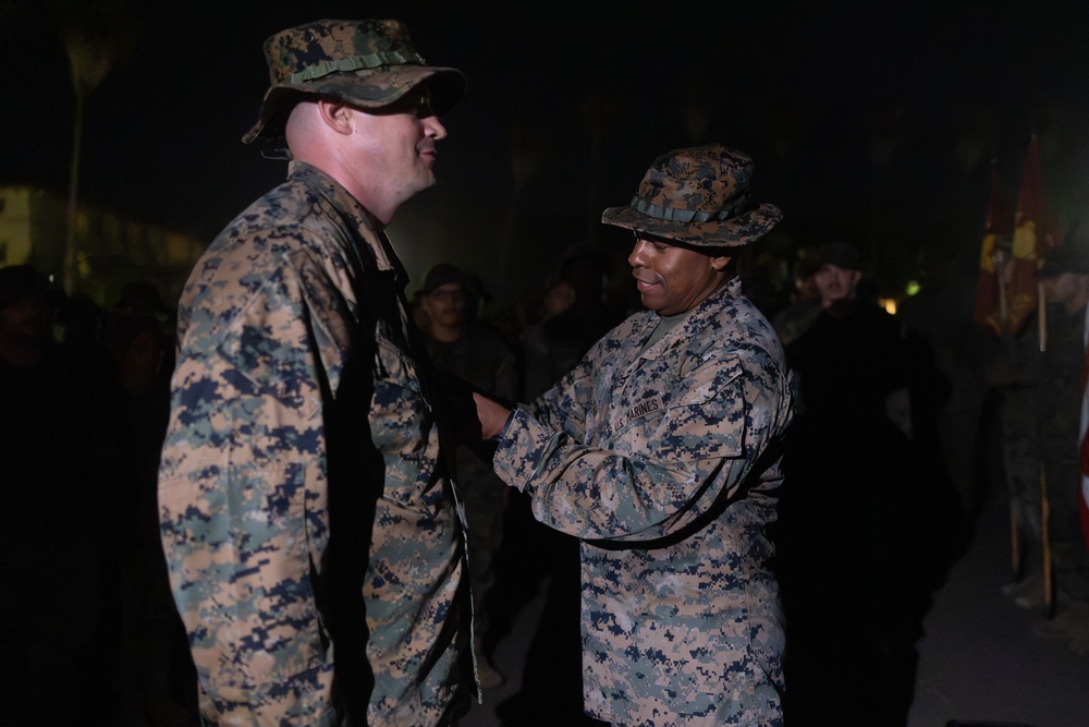 1st Combat Readiness Regiment Marines and Sailors participate in a 10k night hike
