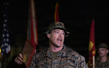 1st Combat Readiness Regiment Marines and Sailors participate in a 10k night hike