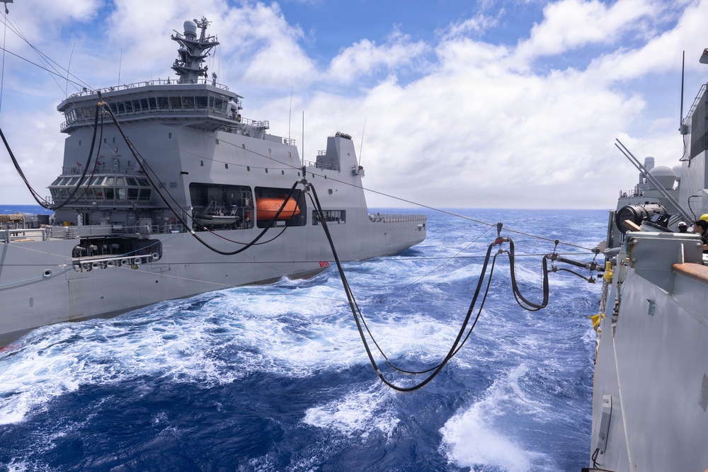 Canadian members of RCN Halifax Class Frigate Regina (FFH 334) participate in replenishment at sea with HMNZS Aotearoa (A11)