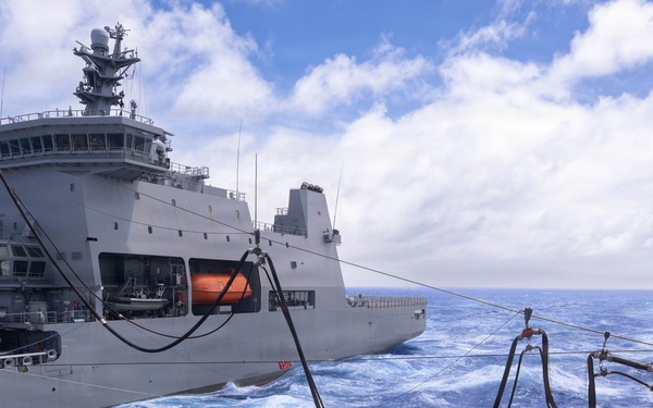 Canadian members of RCN Halifax Class Frigate Regina (FFH 334) participate in replenishment at sea with HMNZS Aotearoa (A11)