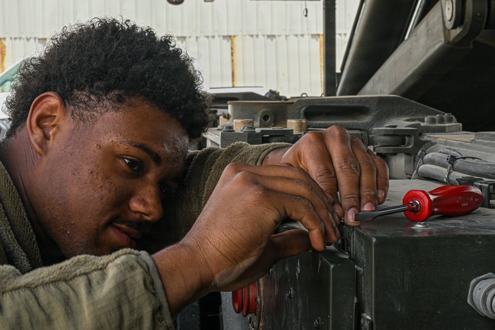 Vehicle maintenance specialist fixes aircraft cargo loader in AOR