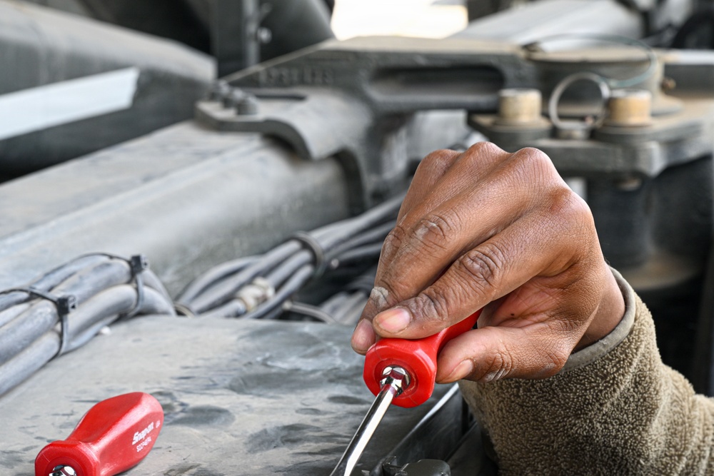 Vehicle maintenance specialist fixes aircraft cargo loader in AOR